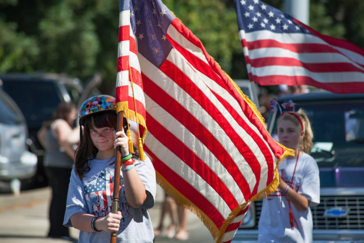 People carrying flag for showing love